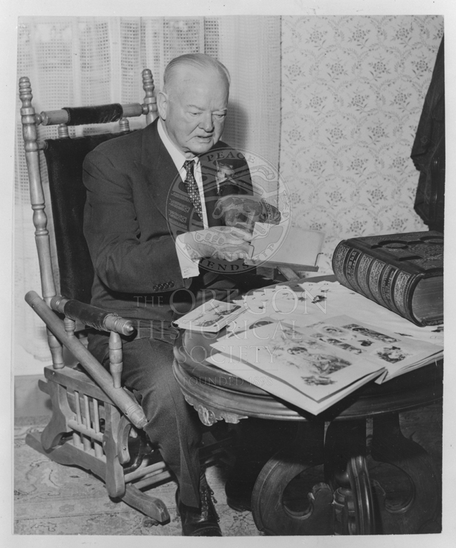 Black and white photot of Herbert Hoover in the parlor of the Hoover-Minthorn House Museum on Dedication Day Black and white photot of Herbert Hoover in the parlor of the Hoover-Minthorn House Museum on Dedication Day